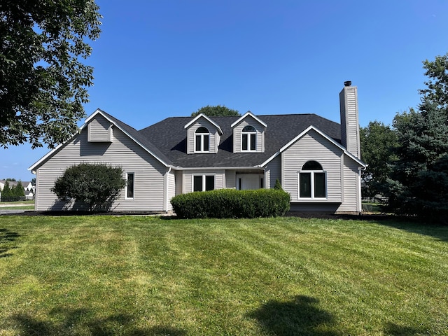 4909 Bixby Rd, Groveport, OH 43125 - view of front of property with a front lawn, a chimney, and a shingled roof