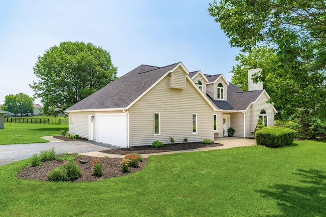 4909 Bixby Rd, Groveport, OH 43125 - view of front of house featuring a chimney, a shingled roof, and driveway