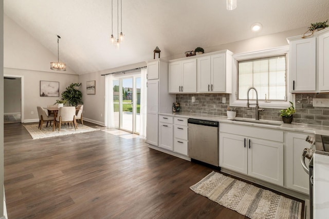 4909 Bixby Rd, Groveport, OH 43125 - kitchen featuring stainless steel dishwasher, a chandelier, vaulted ceiling, light countertops, and tasteful backsplash
