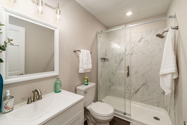 4909 Bixby Rd, Groveport, OH 43125 - full bath with a marble finish shower, vanity, a textured ceiling, and recessed lighting