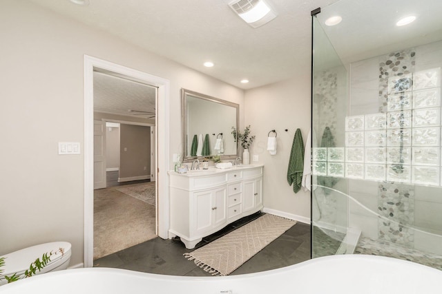 4909 Bixby Rd, Groveport, OH 43125 - full bath with double vanity, walk in shower, a freestanding tub, and recessed lighting