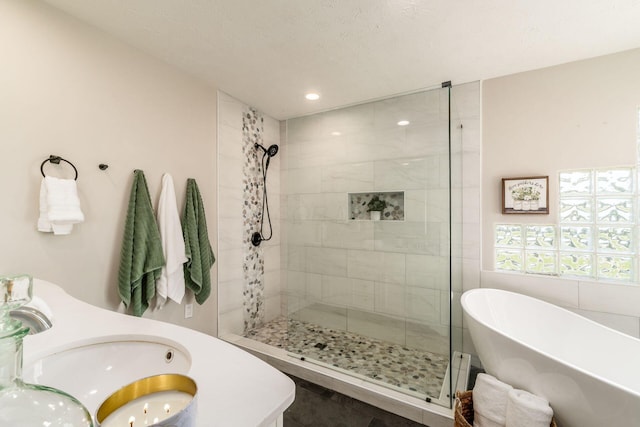 4909 Bixby Rd, Groveport, OH 43125 - bathroom with a freestanding tub, a shower stall, and recessed lighting