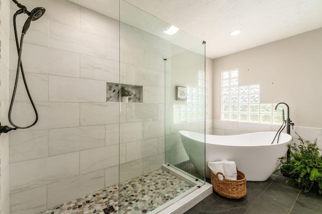 4909 Bixby Rd, Groveport, OH 43125 - full bathroom with tiled shower, a freestanding bath, marble look tiles, and recessed lighting