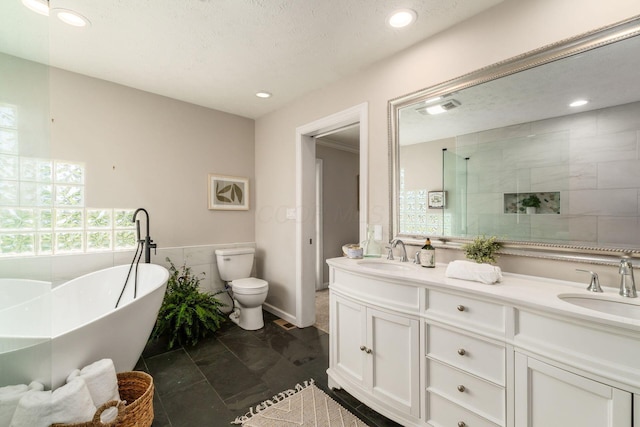 4909 Bixby Rd, Groveport, OH 43125 - bathroom featuring double vanity, a soaking tub, recessed lighting, a tile shower, and a textured ceiling