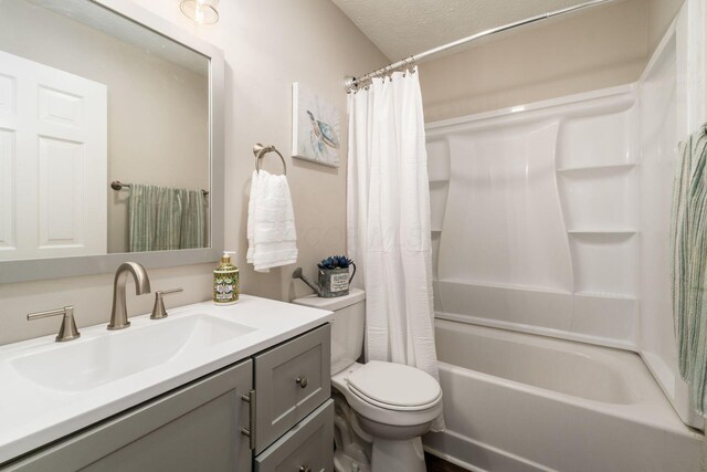 4909 Bixby Rd, Groveport, OH 43125 - full bath with vanity, shower / bath combo with shower curtain, and a textured ceiling