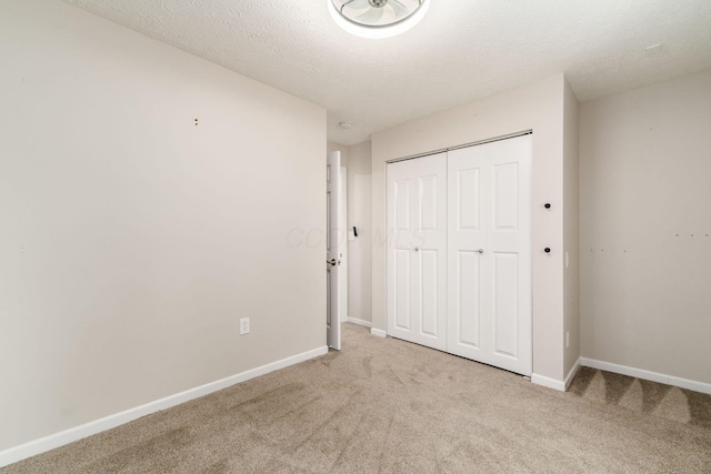 4909 Bixby Rd, Groveport, OH 43125 - unfurnished bedroom featuring carpet floors, a closet, and a textured ceiling