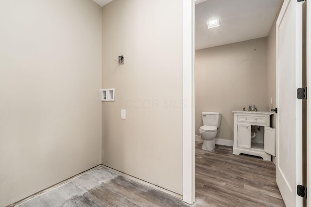 4909 Bixby Rd, Groveport, OH 43125 - bathroom featuring toilet and wood finished floors