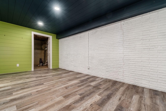 4909 Bixby Rd, Groveport, OH 43125 - spare room featuring wooden ceiling, wood finished floors, wood walls, brick wall, and recessed lighting