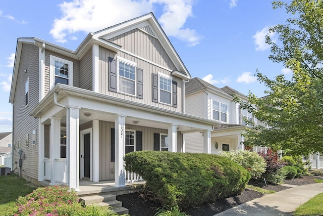 6067 Hayden Farms Rd, Dublin, OH 43016 - view of front facade featuring board and batten siding and a porch