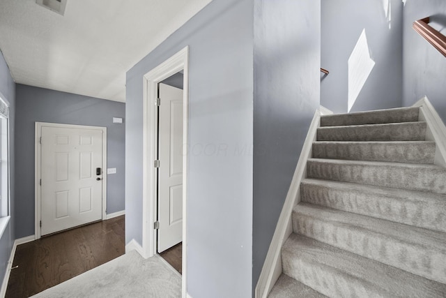 6067 Hayden Farms Rd, Dublin, OH 43016 - staircase with wood finished floors and baseboards