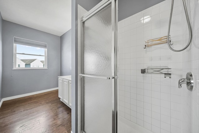 6067 Hayden Farms Rd, Dublin, OH 43016 - full bath featuring a shower stall, wood finished floors, and vanity