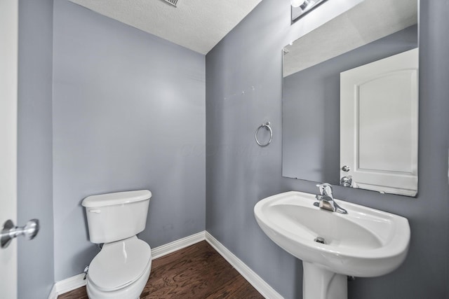 6067 Hayden Farms Rd, Dublin, OH 43016 - bathroom with wood finished floors and a textured ceiling