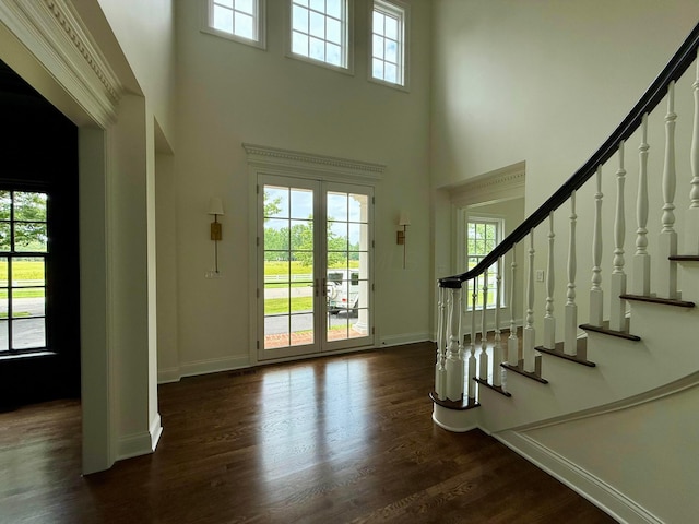 4945 Yantis Dr, New Albany, OH 43054 - entrance foyer featuring a towering ceiling, healthy amount of natural light, stairway, and dark wood-style flooring
