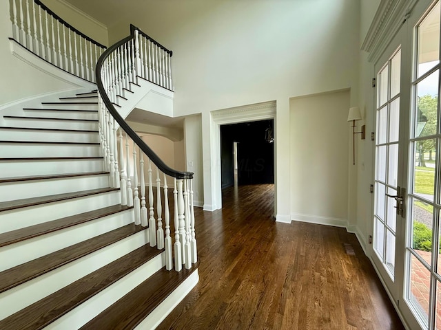 4945 Yantis Dr, New Albany, OH 43054 - entryway with a high ceiling, dark wood-style floors, stairs, and healthy amount of natural light