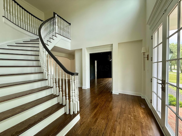 4945 Yantis Dr, New Albany, OH 43054 - staircase with a towering ceiling, wood finished floors, and french doors