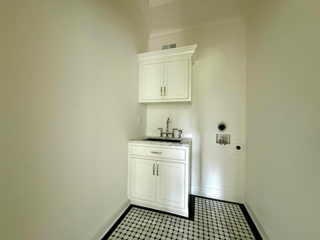 4945 Yantis Dr, New Albany, OH 43054 - laundry room featuring hookup for an electric dryer, cabinet space, washer hookup, and bar with sink