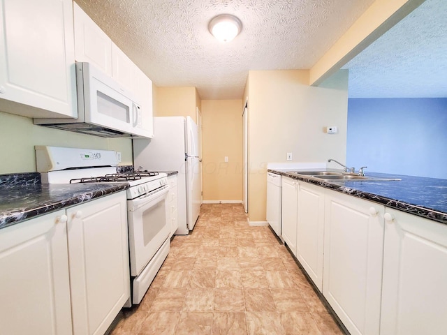 6140 Georges Park Dr Unit 8C, Canal Winchester, OH 43110 - kitchen with white appliances, a textured ceiling, and white cabinets