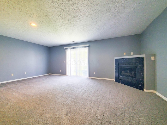 6140 Georges Park Dr Unit 8C, Canal Winchester, OH 43110 - unfurnished living room featuring a fireplace, carpet flooring, a textured ceiling, and recessed lighting