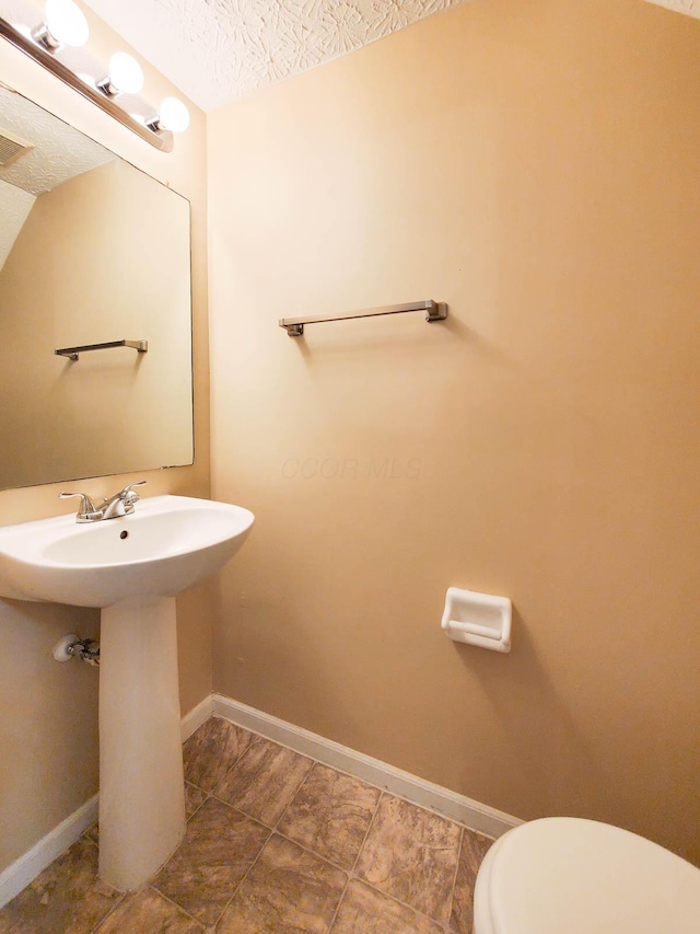 6140 Georges Park Dr Unit 8C, Canal Winchester, OH 43110 - half bath with a textured ceiling and tile patterned floors