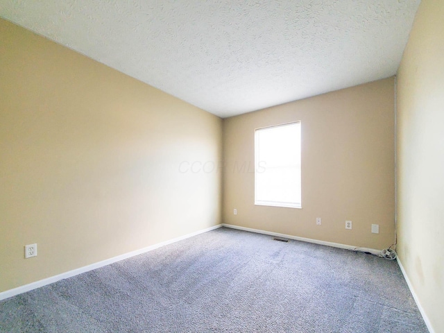 6140 Georges Park Dr Unit 8C, Canal Winchester, OH 43110 - carpeted spare room featuring baseboards and a textured ceiling