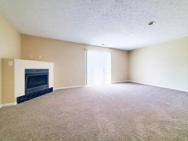 6145 Georges Park Dr Unit 9F, Canal Winchester, OH 43110 - unfurnished living room with carpet floors, a fireplace, and a textured ceiling