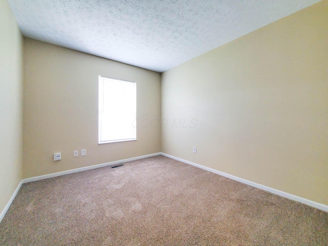 6145 Georges Park Dr Unit 9F, Canal Winchester, OH 43110 - unfurnished room with carpet floors and a textured ceiling
