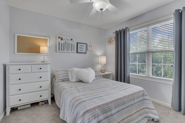 9606 Ireland Ct, Powell, OH 43065 - bedroom featuring light colored carpet, multiple windows, and a ceiling fan