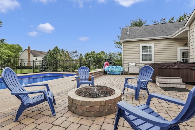 9606 Ireland Ct, Powell, OH 43065 - fenced backyard with a hot tub, an outdoor fire pit, and a patio area