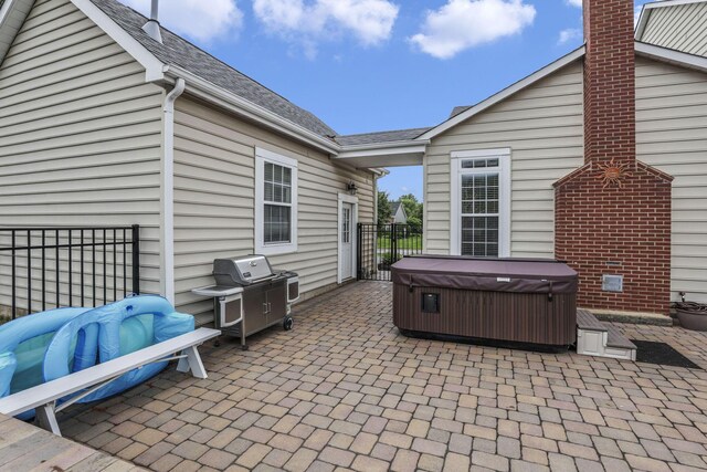 9606 Ireland Ct, Powell, OH 43065 - view of patio / terrace featuring a hot tub and a grill