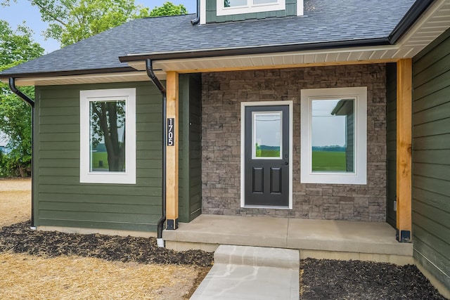 1705 Horseshoe Rd, Delaware, OH 43015 - doorway to property featuring roof with shingles and stone siding