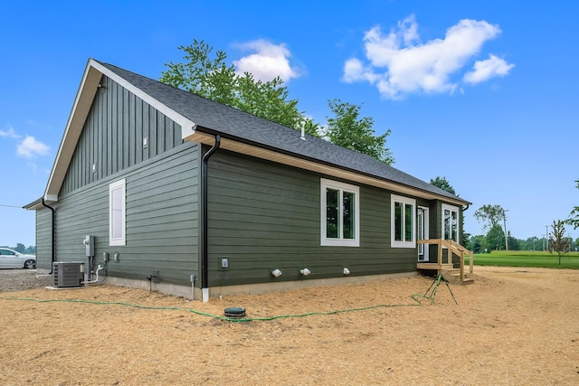 1705 Horseshoe Rd, Delaware, OH 43015 - view of home's exterior with board and batten siding and a central air condition unit