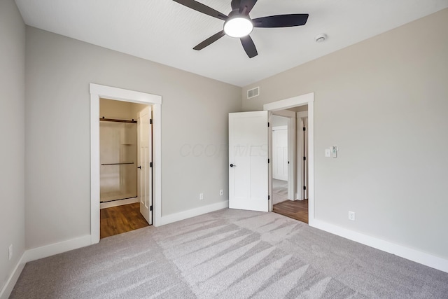 1705 Horseshoe Rd, Delaware, OH 43015 - unfurnished bedroom with carpet flooring, ensuite bathroom, and ceiling fan