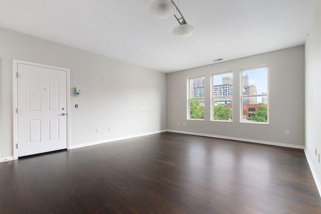 121 E Noble St Unit 3, Columbus, OH 43215 - empty room featuring dark wood finished floors and baseboards