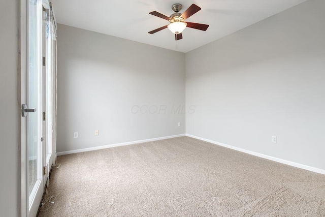 121 E Noble St Unit 3, Columbus, OH 43215 - spare room with a ceiling fan, carpet floors, and healthy amount of natural light
