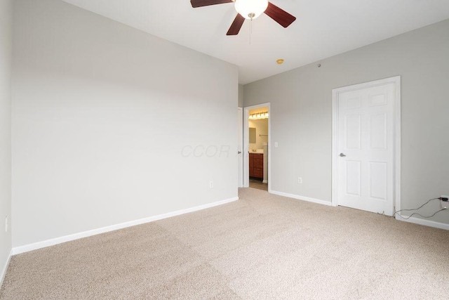 121 E Noble St Unit 3, Columbus, OH 43215 - unfurnished bedroom with light colored carpet, ensuite bath, and ceiling fan