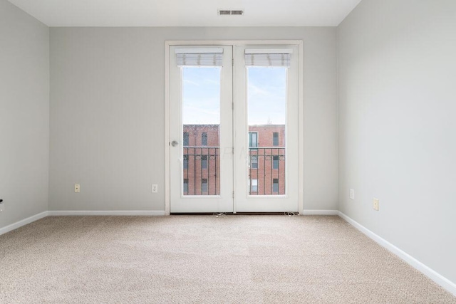 121 E Noble St Unit 3, Columbus, OH 43215 - carpeted empty room with baseboards