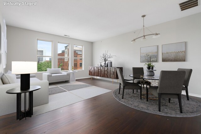 121 E Noble St Unit 3, Columbus, OH 43215 - dining room featuring wood finished floors and a chandelier