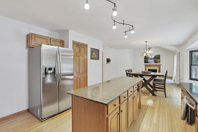 2680 Biers Run Rd, Chillicothe, OH 45601 - kitchen featuring stainless steel fridge, light wood-style flooring, a center island, and dark stone countertops