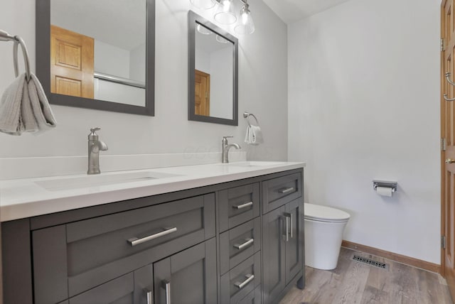 2680 Biers Run Rd, Chillicothe, OH 45601 - full bathroom with double vanity and wood finished floors