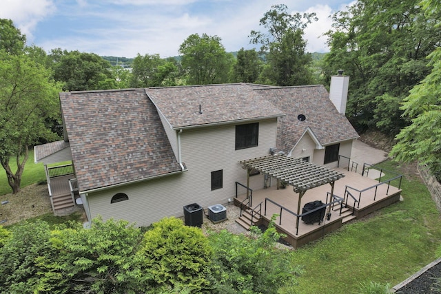 2680 Biers Run Rd, Chillicothe, OH 45601 - rear view of house featuring a deck, a chimney, a lawn, and roof with shingles