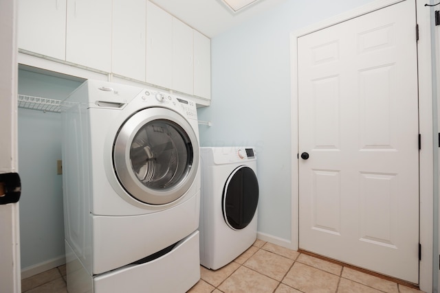337 Masonglen Ct, Pataskala, OH 43062 - washroom featuring independent washer and dryer, cabinet space, and light tile patterned floors