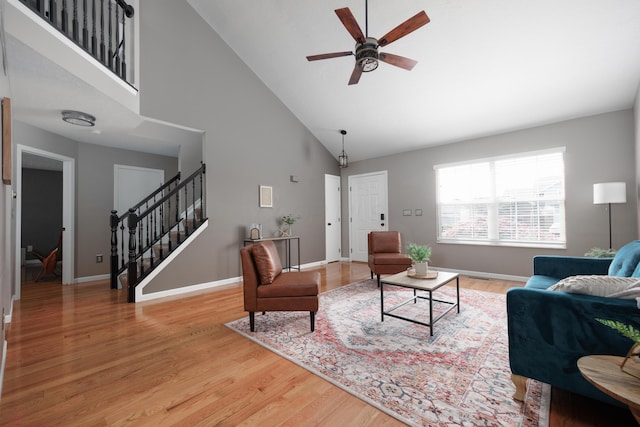 337 Masonglen Ct, Pataskala, OH 43062 - living area featuring stairway, high vaulted ceiling, ceiling fan, and light wood-style floors