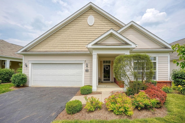 5428 Tathwell Dr, New Albany, OH 43054 - view of front facade with asphalt driveway and a garage