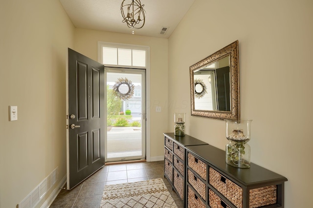5428 Tathwell Dr, New Albany, OH 43054 - foyer with plenty of natural light and dark tile patterned floors