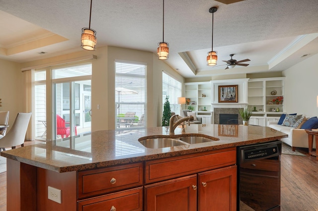 5428 Tathwell Dr, New Albany, OH 43054 - kitchen with dishwasher, a tray ceiling, open floor plan, wood finished floors, and ceiling fan