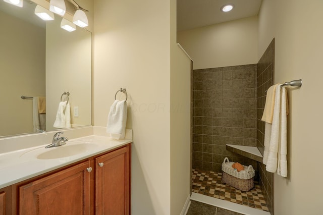 5428 Tathwell Dr, New Albany, OH 43054 - bathroom with a walk in shower, vanity, tile patterned floors, and recessed lighting