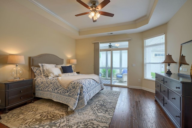 5428 Tathwell Dr, New Albany, OH 43054 - bedroom featuring a tray ceiling, access to exterior, multiple windows, dark wood-style floors, and ornamental molding