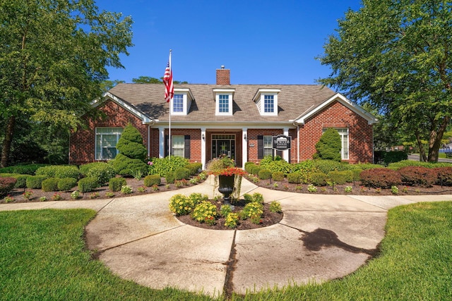 5428 Tathwell Dr, New Albany, OH 43054 - view of front of home featuring brick siding and a chimney