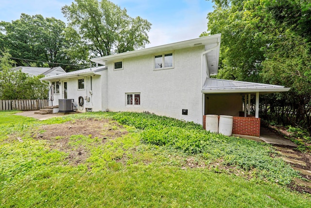 582 E Stanton Ave, Columbus, OH 43214 - back of house featuring stucco siding, a standing seam roof, and a metal roof