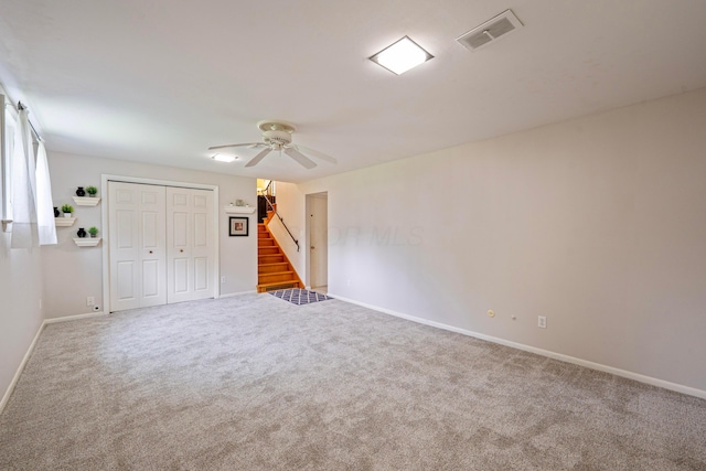 582 E Stanton Ave, Columbus, OH 43214 - unfurnished bedroom featuring carpet flooring, ceiling fan, and a closet